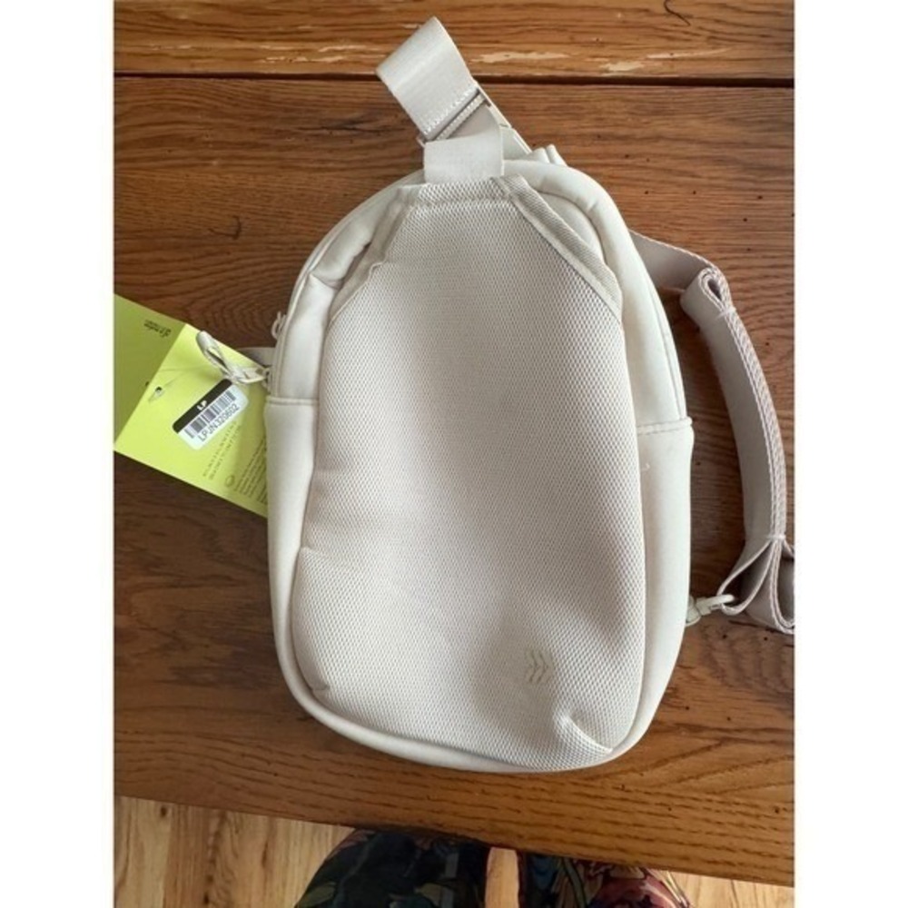 All In Motion Sling Crossbody Bag Cream Hidden Pocket Purse Sporty